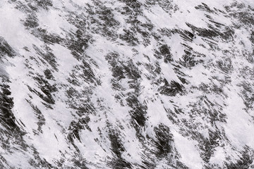 Black with grey ink texture with abstract washes and brush strokes on white watercolor paper background.