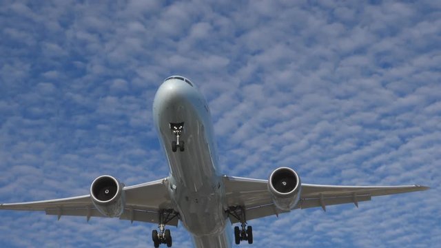 Epic slow motion shot of commercial jet coming into land. Boeing 787-9 Dreamliner. Pearson International Airport, Toronto, Canada. No logos visible.