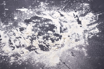 photo texture gray background with scattered flour, blurred