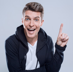 Fototapeta premium surprised handsome man pointing copy space