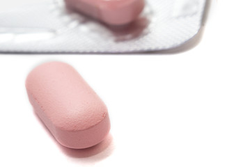 Obraz na płótnie Canvas One red pill close-up