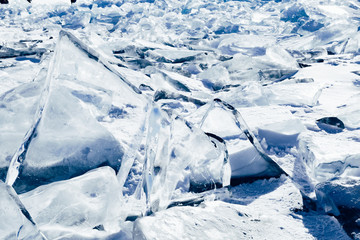 Blocks of ice gleaming in the sun. Arctic winter background.