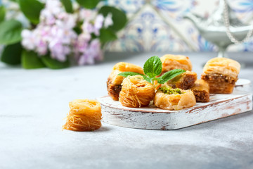 Traditional arabic dessert Baklava with honey and nuts, selective focus