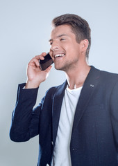 young guy in a jacket talking on the phone