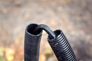 Electrical cable of high voltage in a protective casing, close-up.