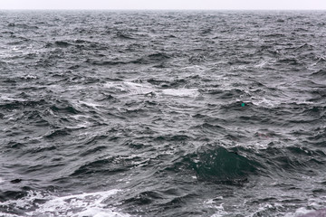 seascape of stormy sea on the horizon overcast sky.