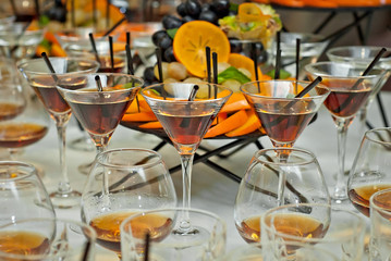 Glass glasses with colored drinks on the table. alcoholic drinks at the buffet