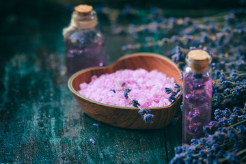 Fototapeta na wymiar Concept spa therapy. Fresh lavender blossoms with Natural handmade lavender oil, sea salt.