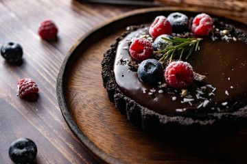 Tart Chocolate cheesecake with fresh berries. delicious dessert for Birthday.