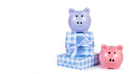 Piggy banks and gifts. New Year gifts. Christmas presents. Gift box and piggy bank. Copy space.