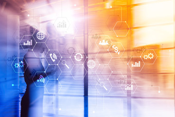 Double exposure mixed media. Diagrams and icons on hologram screen. Business people and modern city on background.