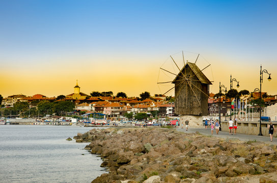 Sunset over old windmill in the ancient town of Nesebar in Bulgaria