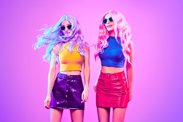 Fashion. Disco Party girl dance in neon light