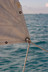 A rope and girth hitch on a jib sail eyelet