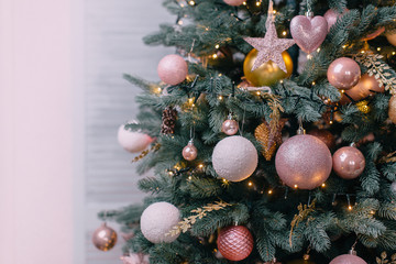 decorated christmas tree near white wall