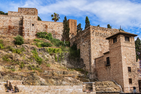 Malaga ancient ruins of Roman Theater (El Teatro Romano) at foot of famous Alcazaba fortress. Roman Theater is oldest monument in Malaga City, it was built in I century BC. Malaga, Andalusia, Spain.