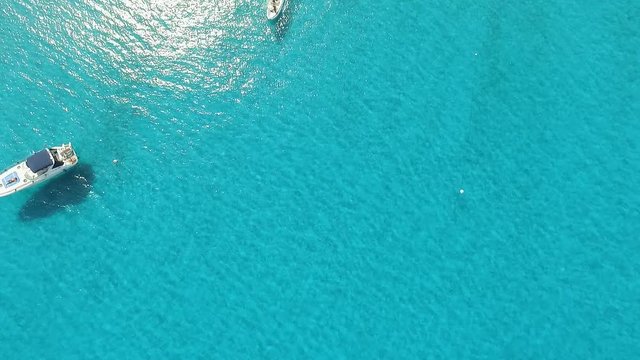 Aerial view of a sea in front of Mortorio island in Sardinia. Amazing beach with a turquoise and transparent sea. Cagliari, Sardinia, Italy