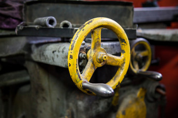 Lever-wheel at the lathe. Fragment of the lathe in the workplace