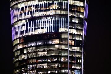 Obraz premium Modern office building at night. Night lights, city office building downtown, cityscape view