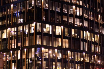 Modern office building at night. Night lights, city office building downtown, cityscape view