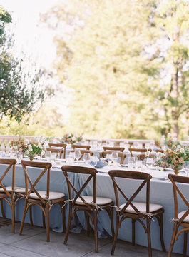 Place settings at an outdoor wedding reception