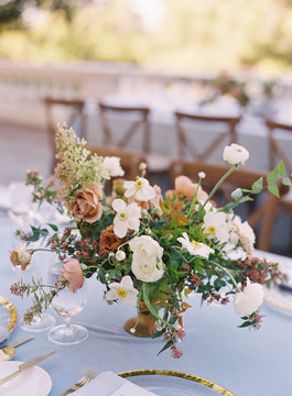 Flowers as a centerpiece on a table for a wedding reception