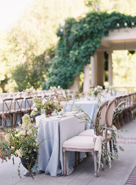 Place settings at an outdoor wedding reception