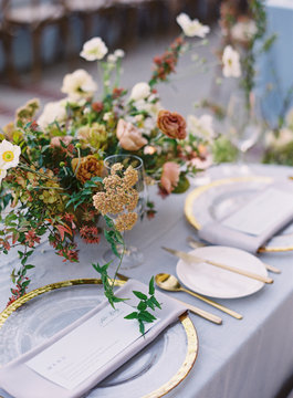 Place settings at an outdoor wedding reception