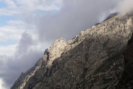 Mountains with clouds in the Restonica valley in Corsica