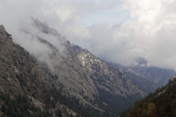 Mountains with clouds in the Restonica valley in Corsica