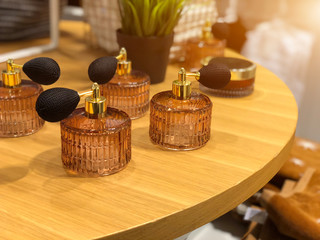 Swirling decorative glass perfume bottle and atomizer with bulb.