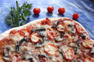 tasty pizza with mushrooms on blue