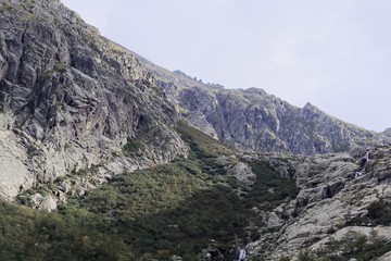Obraz premium Mountains with clouds in the Restonica valley in Corsica