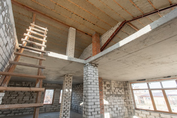 The second attic floor of the house. overhaul and reconstruction. Working process of warming inside part of roof. House or apartment is under construction, remodeling, renovation, restoration.