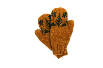 Yellow knitted mittens with green handmade pattern on a white background. View from above.
