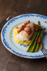 cod on plate with sparris and bacon