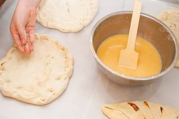 Young children make dough products. Hands closeup