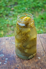canned homemade pickles cucumbers in a glass jar