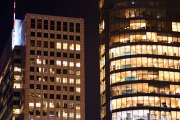 Obraz premium Modern office building at night. Night lights, city office building downtown, cityscape view