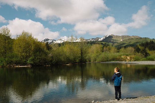 Young boy fishing at a lake