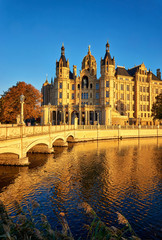 Schwerin Palace with castle bridge in autumn. Germany