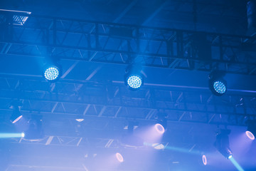 Blue stage lights close up. Colorful show detail