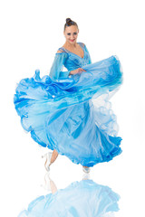 Girl on smiling face dressed in luxury blue dress posing with posture. Dancer of ballroom dance...
