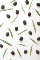Olives and its leaves on a white background
