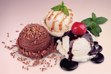 Ice cream scoops  with vanilla, chocolate and berry scoops and