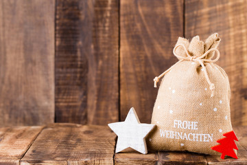 Christmas greeting card wooden background.