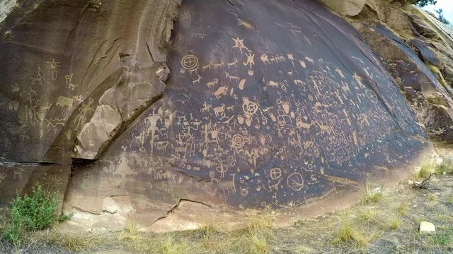 Newspaper Rock, on BLM land near Moab, Utah. Camera handheld, panning left to right.