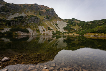 Fototapeta na wymiar hiking trails in Slovakia Tatra mountains near mountain lake of Rohache
