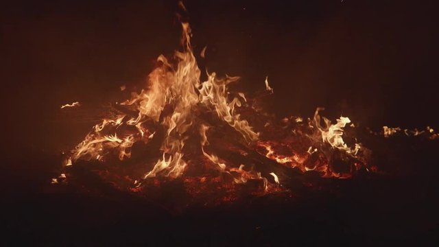 close up bonfire flames of camping fire in slow mo 120fps