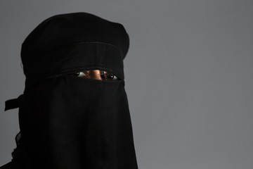 Muslim arab woman with black niqab